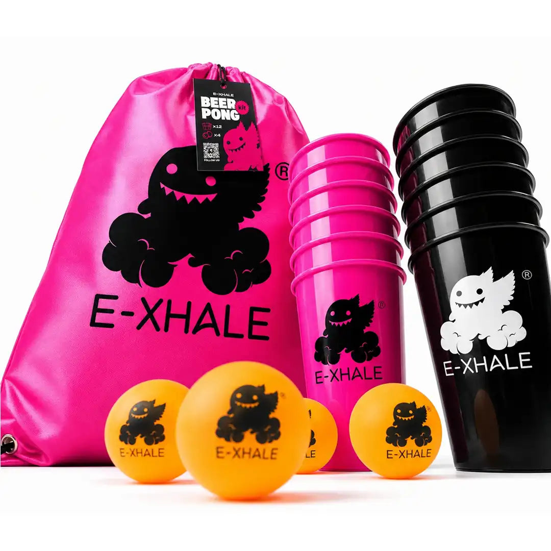 E-XHALE beer pong set with a bright pink drawstring bag, stacked pink and black cups, and four orange balls, all featuring the E-XHALE logo and monster graphic on a white background.