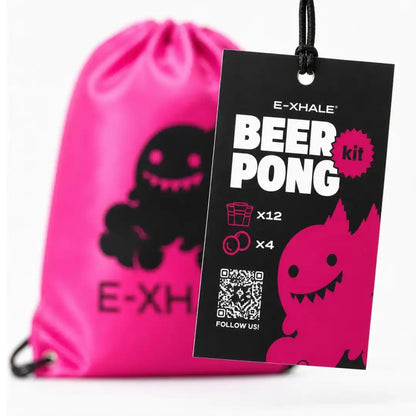 A bright pink drawstring bag with a black cartoon monster graphic in the foreground, with a black hangtag reading E-XHALE BEER PONG kit hanging in front on a white background.